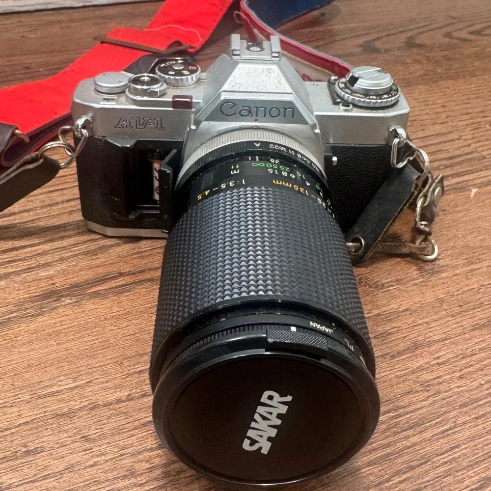Canon AV 1 35mm SLR Film Camera Silver Sakar 35 135mm Lens Strap Untested